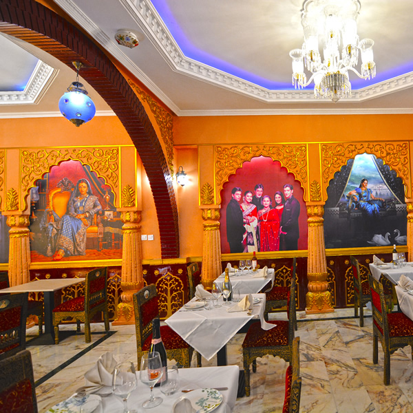 Elegant table settings under chandeliers in our saloon