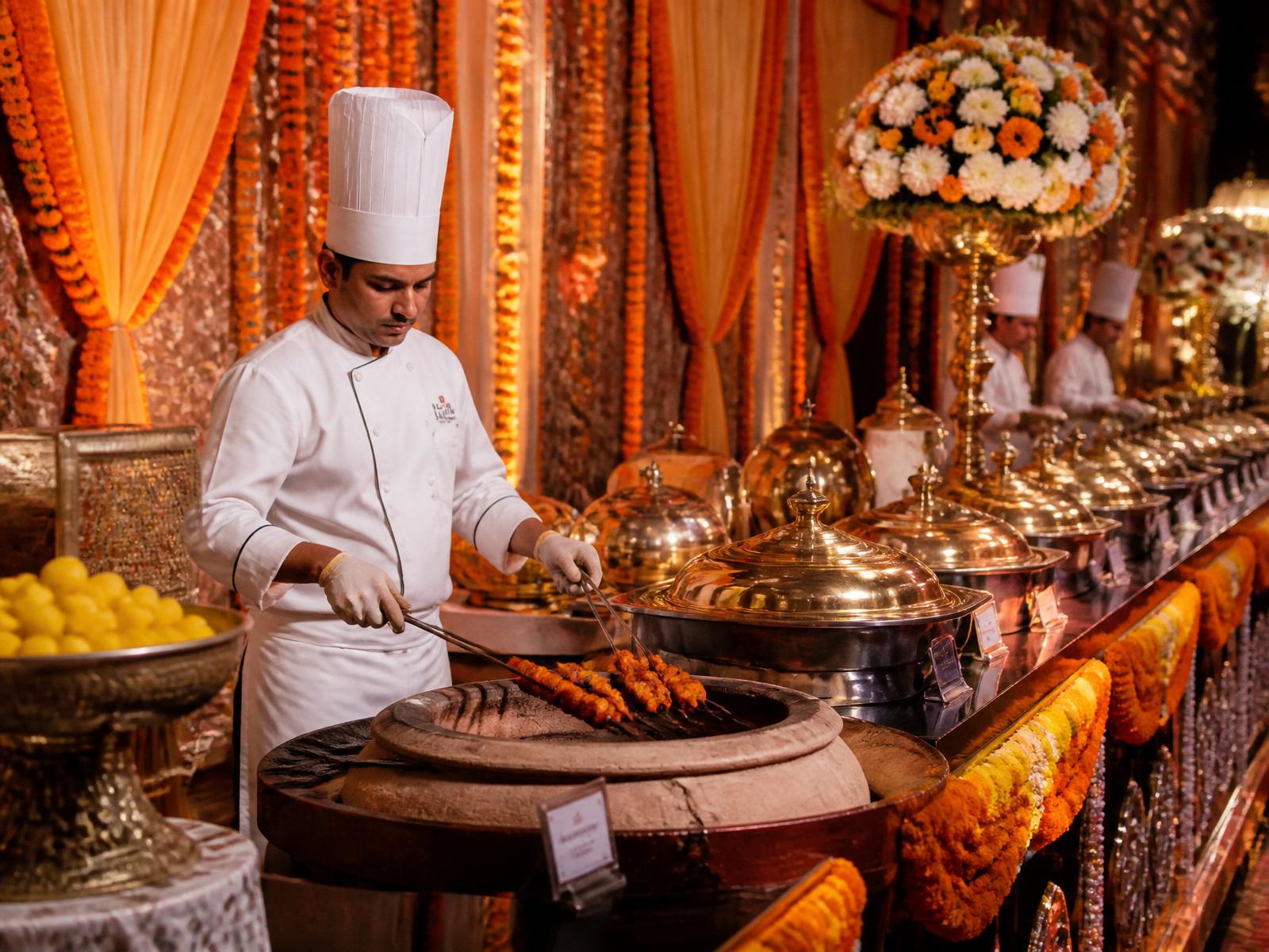 Luxury Indian wedding catering with copper chafing dishes and live tandoor